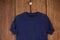 Navy blue t-shirt on hanger