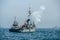 Navy warship gunning salute on sea in international fleet review