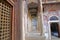 NAWALGARH, RAJASTHAN, INDIA - DECEMBER 25, 2017: Bhagat Haveli with colorful frescoes and paintings and a wooden door in the foreg