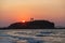 Naxos island, sunset over Temple of Apollo, Cyclades Greece. People admire the sundown background