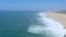 Nazare, portugal - circa october 2018 - waves touching beach