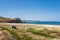 Nazare, Portugal - June 29, 2021: View of the fortification and lighthouse of Nazare from the North Beach