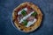 Neapolitan pizza with edges, chilli spices tomatoes and mozzarella