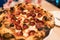 Neapolitan pizza style: close-up chorizo sausage pizza. Ingredients such as chorizo sausage, mozzarella cheese, sliced radish.