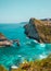 Near Atuh beach, Nusa Penida island, Bali, Indonesia. Ocean waves, cliffs, tropical plants