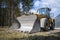 Near perspective view to huge wheel loader with big shovel
