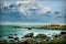 Near the sea coast, house near the sea, stones in the water