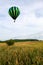 Near Wausau, Wisconsin, USA, July 10, 2021, Taste N Glow Balloon Fest. Hot air balloon in the the sky looking for a place to land