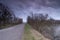 Near WIerum at dusk, road and river, in spring condition