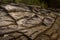 Nearly dry riverbed with exposed layered rocks