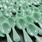 Neat Arrangement of Mint Green Plastic Spoons