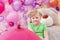 Neat little girl posing in studio with balloons