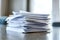 Neat stack of papers on table symbolizes organization paperwork and office tasks. Concept Office