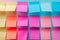 Neatly arranged blank post it notes on wall create visually pleasing grid pattern