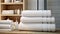 neatly folded fluffy towels in a closet within a lavish sports shower or spa pool, a minimalist modern composition that