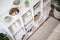 Neatly folded linen cupboard shelves storage at eco friendly straw basket placed closet organizer