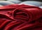 neatly folded red velvet blanket