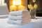 Neatly folded white towel on a luxurious hotel resort bed