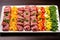 neatly lined beef skewers showcasing variety