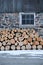 Neatly stacked firewood by an old Ontario Barn in winter