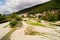 Nebug River. Mountains of the Caucasus. Forest plantations in the mountains. The river goes into the mountains. Houses