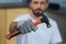 Necessary hand tool. Close up shot of hand of young repairman holding a hammer