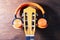 Neck of the old guitar and modern wireless headphones. music concept