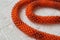 Necklace fragment from bright orange beads