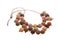 Necklace made from brown porous beads isolated on white background. Female accessories, decorative ornaments and jewelry.