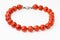 Necklace from natural polished red coral balls