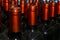 Necks of wine bottles with bright red foil closeup