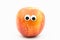 Nectarine with googly eyes on white background - nectarine face