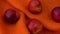 Nectarine isolated on orange background