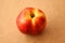 Nectarine on wooden background