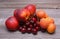 Nectarines, cherries and apricots on wooden table