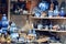 NEDERLAND, AMSTERDAM - AUGUST 7, 2019: handmade ceramics on a white and blue store shelf, souvenirs