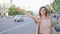 Need ride home woman gesturing taxi standing road
