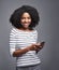 Need to talk to someone Catch me on my mobile. Studio portrait of a young woman using a mobile phone against a gray