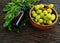 Neem leaf and neem fruit on wooden table. Neem oil is moisturizing oil