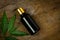 Neem oil in bottle on wooden background.