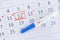 Negative pregnancy test with circling date in calendar. Planning of pregnancy, trying to have baby