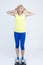 Negatively Surprised Mature Caucasian Sportswoman in Jogging Blue and Yellow Outfit While Checking Weight With Floorstanding Weigh