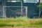 Neglected empty soccer football net on field , unused, dilapidated , Old goal