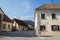 Neglected old house buildings, some abandoned, typical of Central European architecture on the deserted empty main street