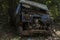 Neglected Old Rusted wreckage  truck in jungle