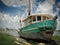A neglected shrimp boat sits idle in coastal Louisiana