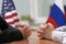 Negotiation of USA and Russia. Statesman or politicians with clasped hands