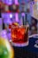 Negroni Cocktail with the background of a bar. Beverage Photography.