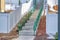 Neighborhood stairway along homes with white wooden fences and snowy yards