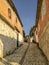 Neighborhood street paved with marble stones in Ixcateopan, uphill view. Travel in Mexico